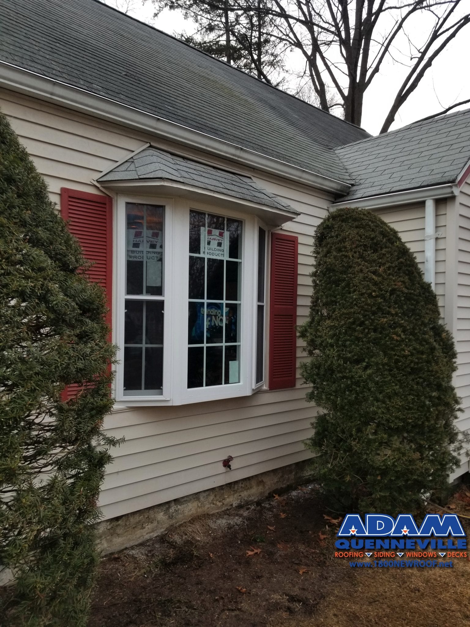 This is a photo of a completed siding replacement project with beige siding.