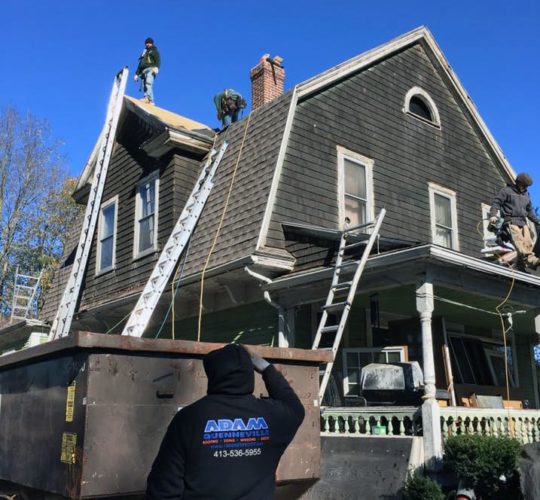 Roof Being Repaired By Adam Quenneville Roofing Crew