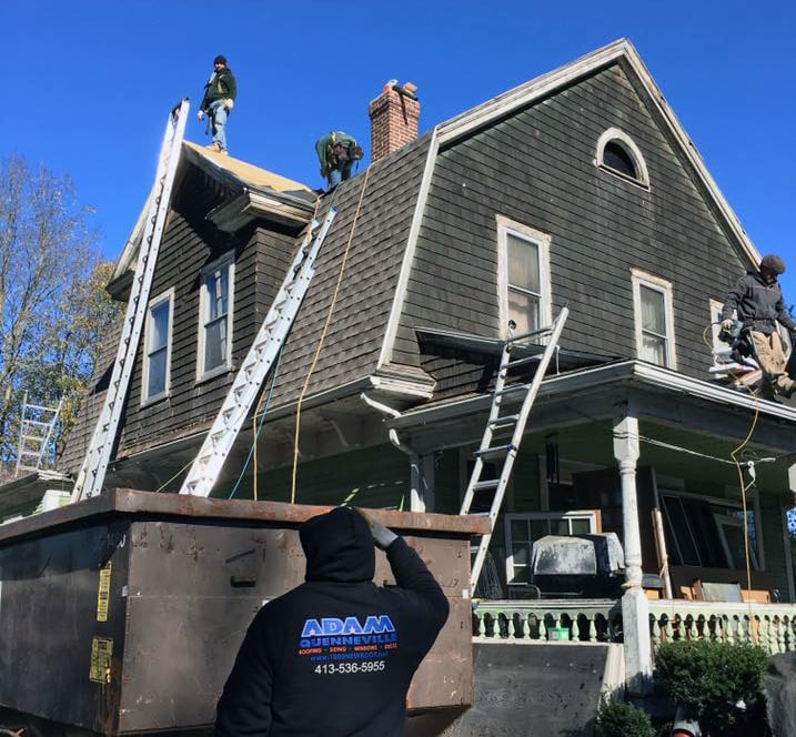 roof being repaired by Adam Quenneville Roofing crew