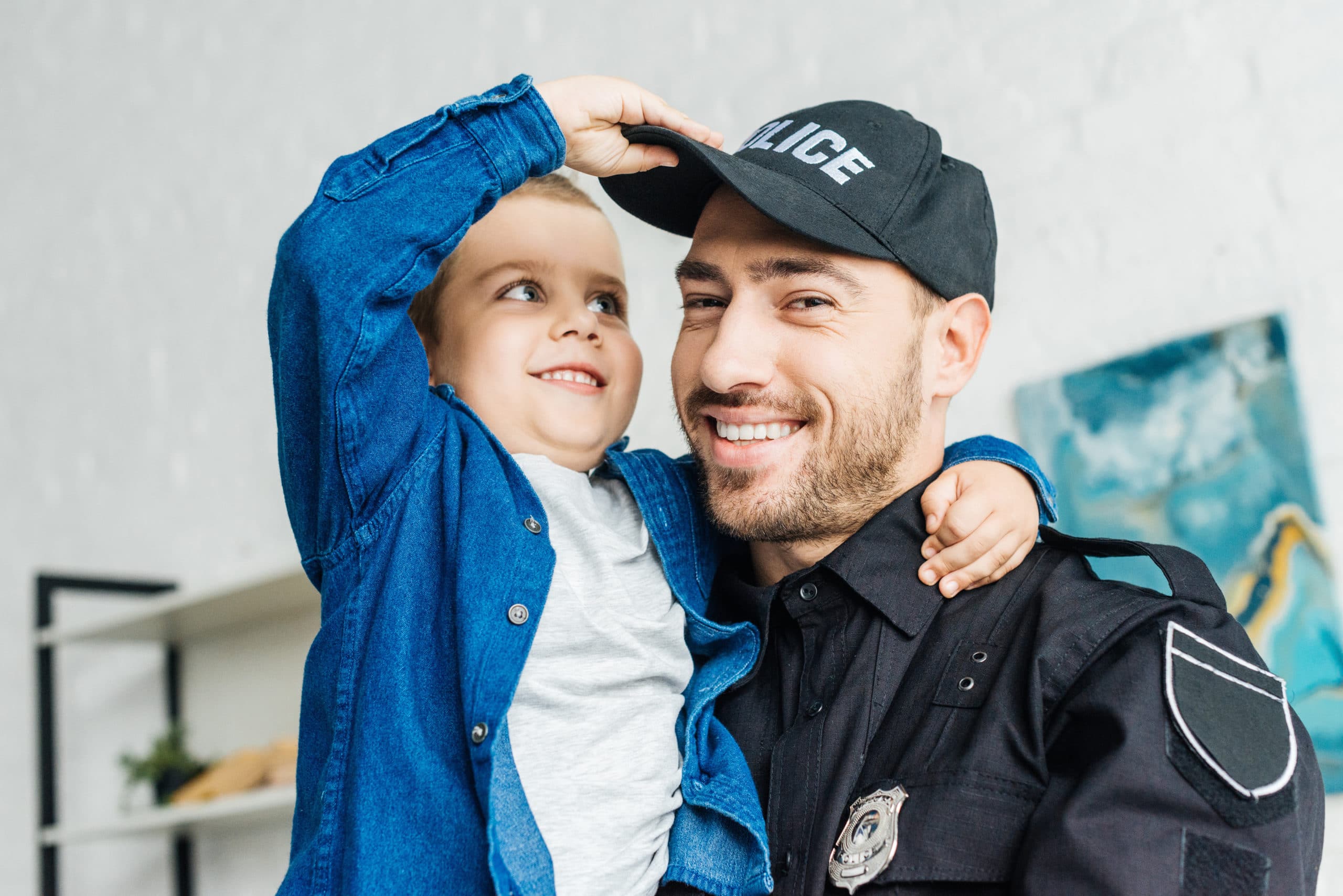 smiling police officer with child
