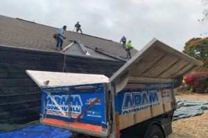 Adam Quenneville Roofing team at work up on a roof