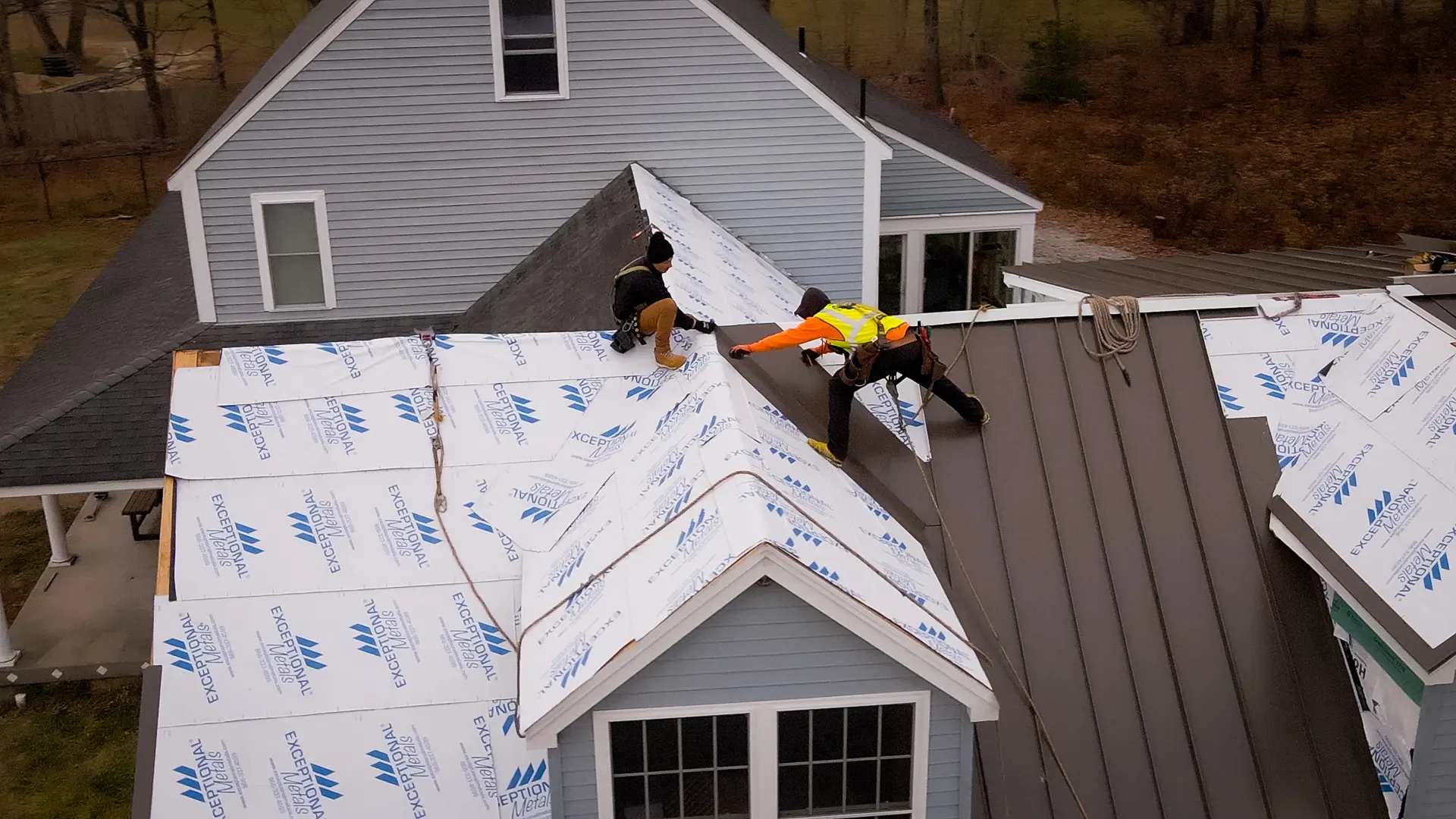 a group of men working on a roof