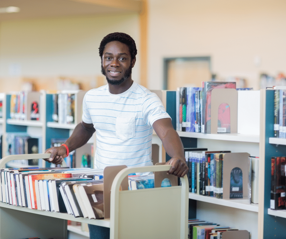 a school librarian re-shelves books