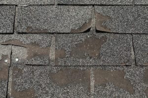 shingles with damage and missing granules